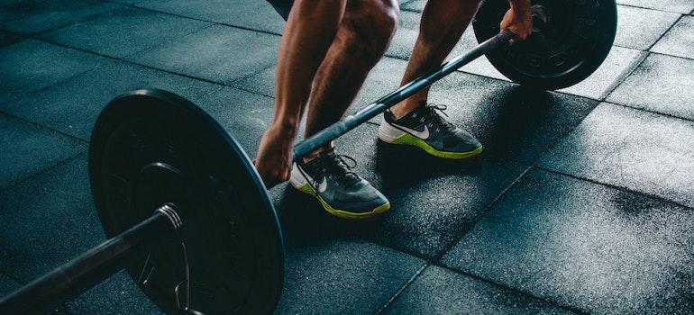 a man lifting barbells