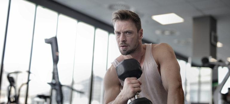 a man at the gym thinking about a perfect detox workout plan